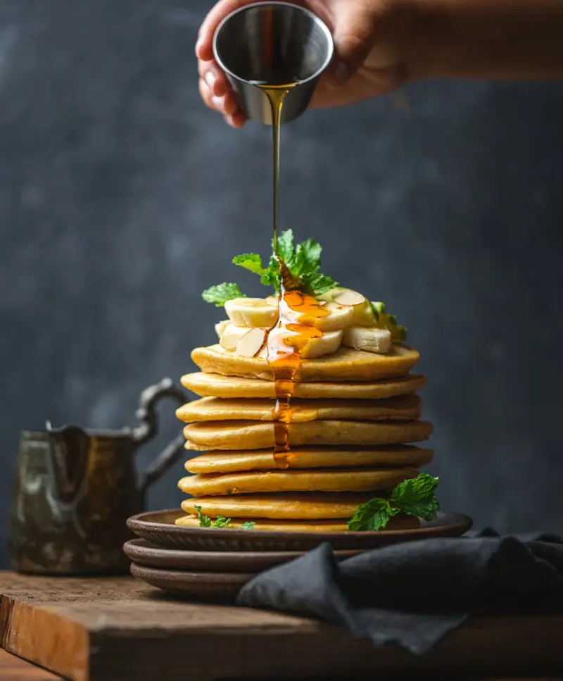 Golden fluffy pancakes with berries